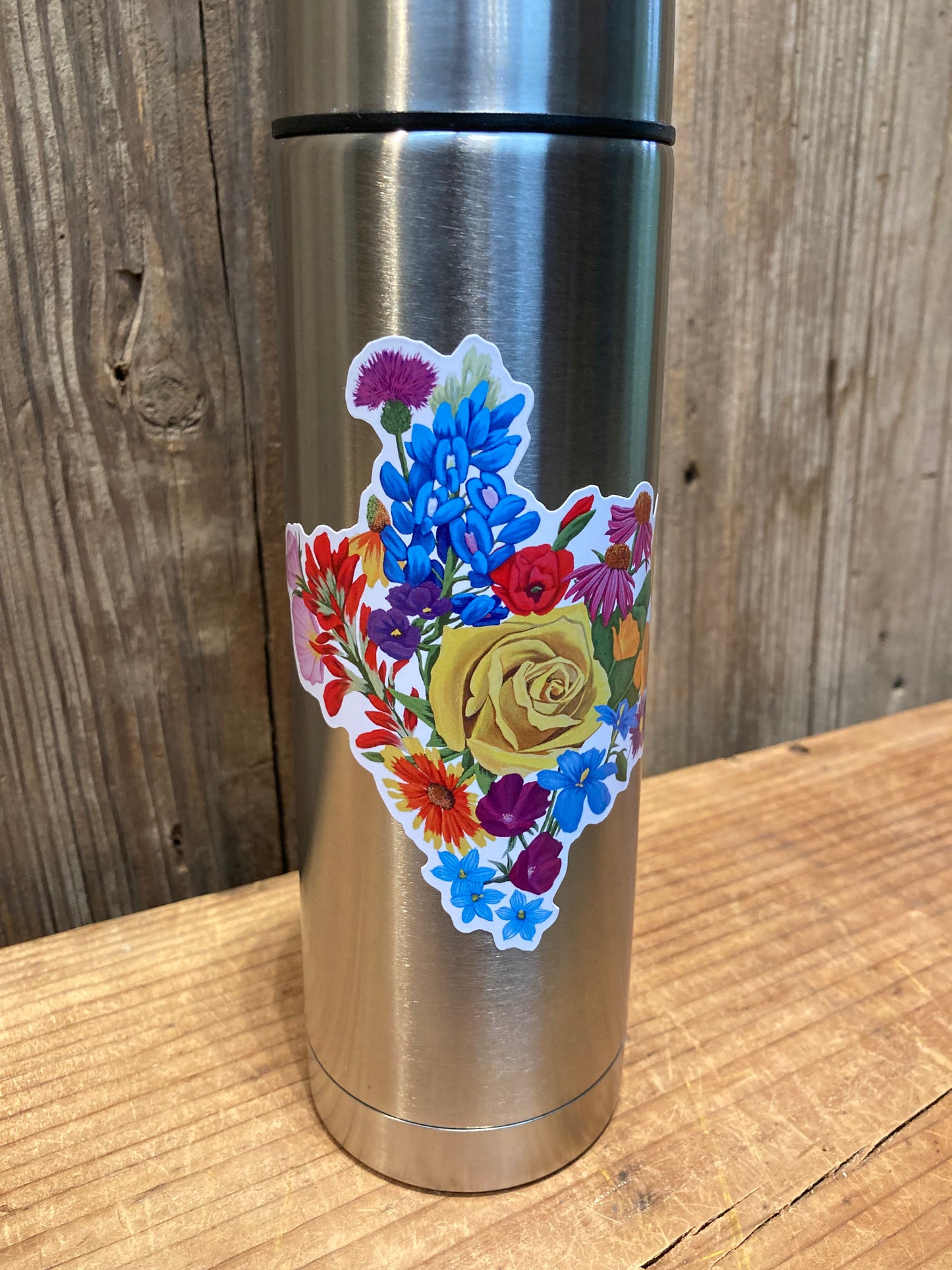 Texas Floral sticker applied to a stainless steel tumbler.