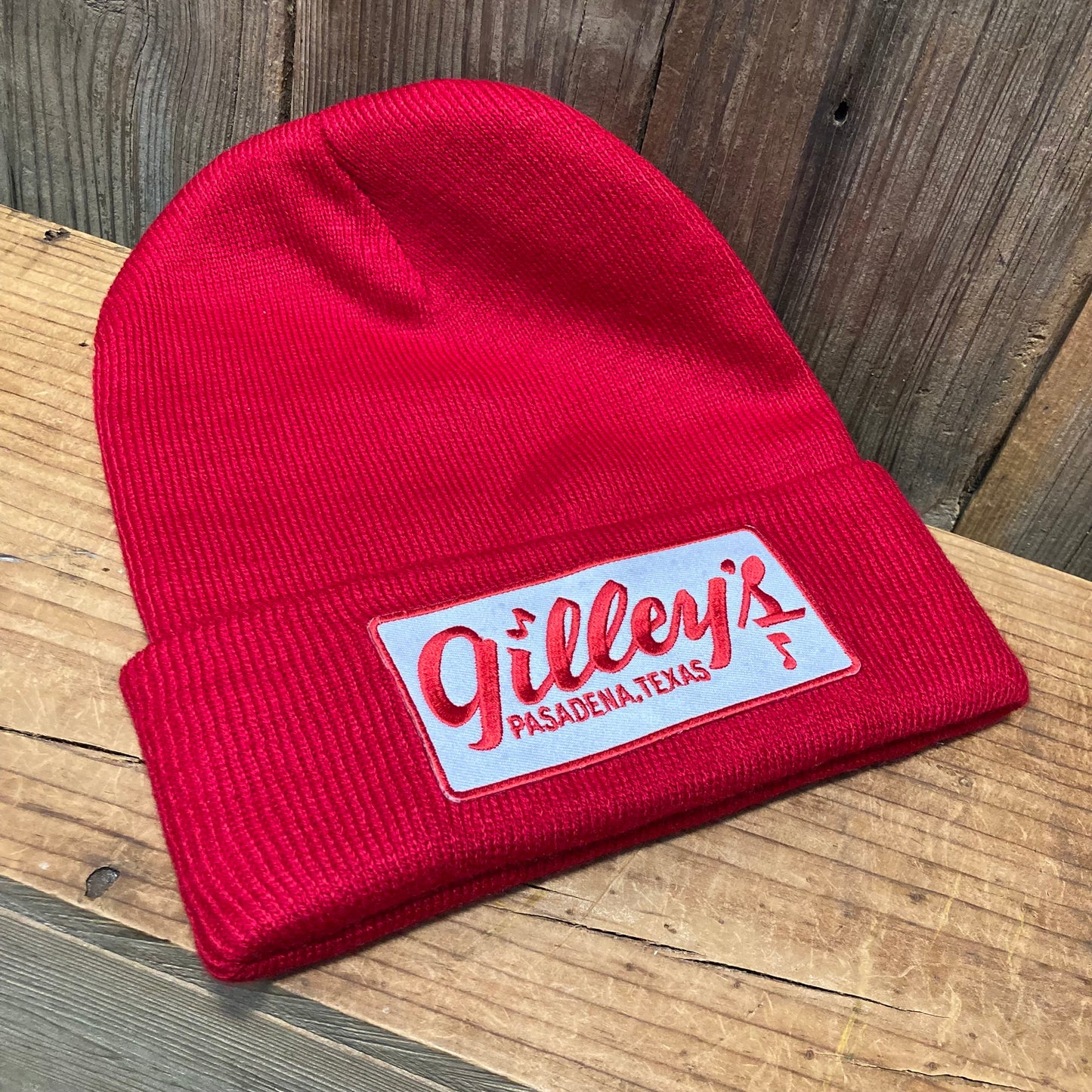 Gilley's Beanie in red with the iconic logo patch, made from 100% acrylic for a warm and stylish look. One size fits all.