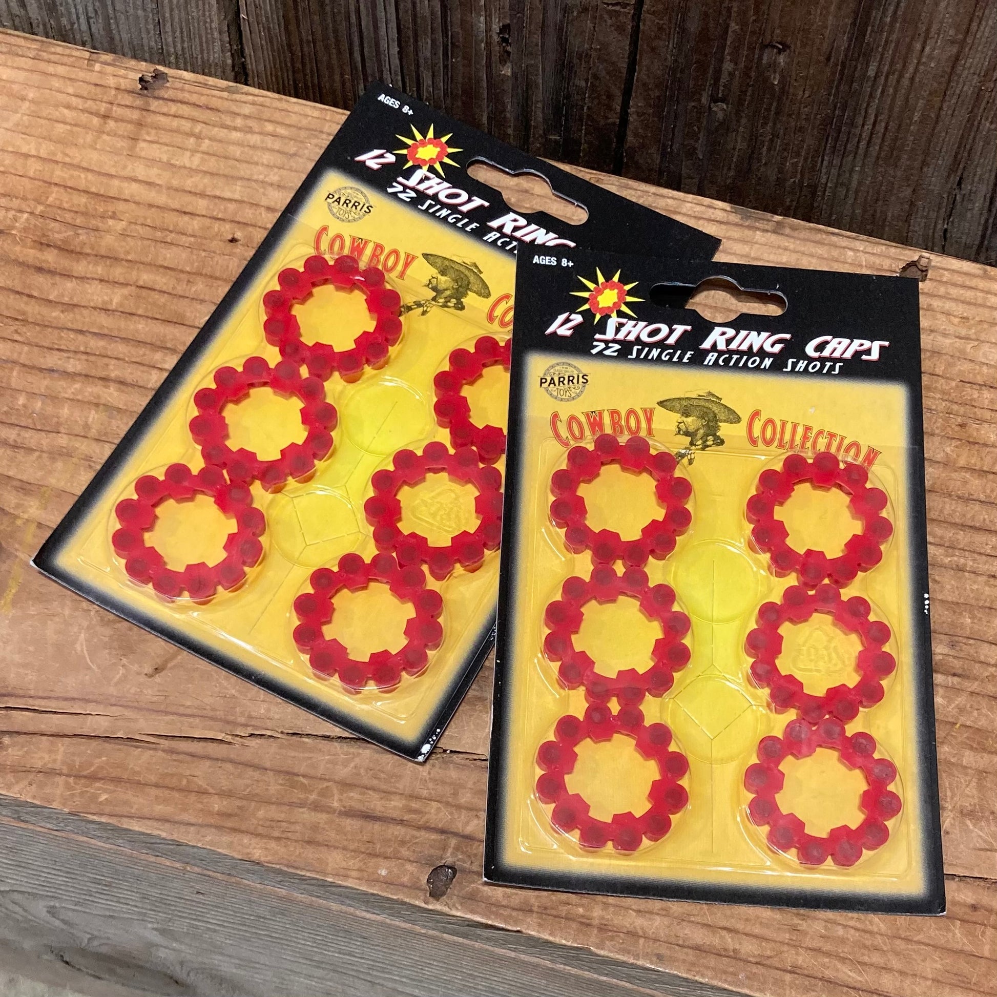 two packs of red 12-shot ring caps for toy cowboy pistols with 6 rings per pack