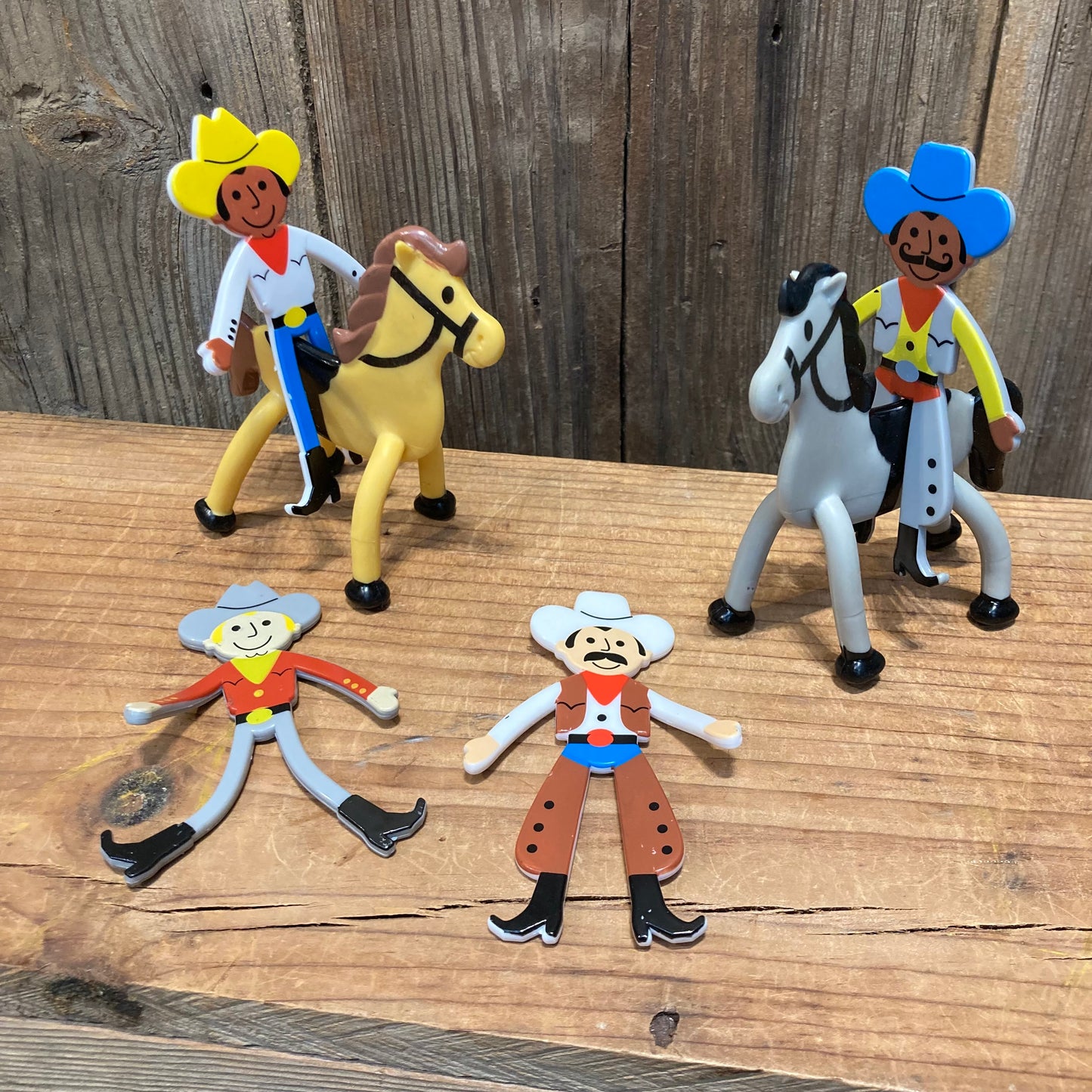 Bendable Horses
Cowboys and cowgirls sold separately.

4" tall, vinyl. yell hat, yellow horse with dark skin. blue hat, grey horse, with mustache and dark skin. Light skin options include grey hat,  and grey hat with chaps and mustache. 