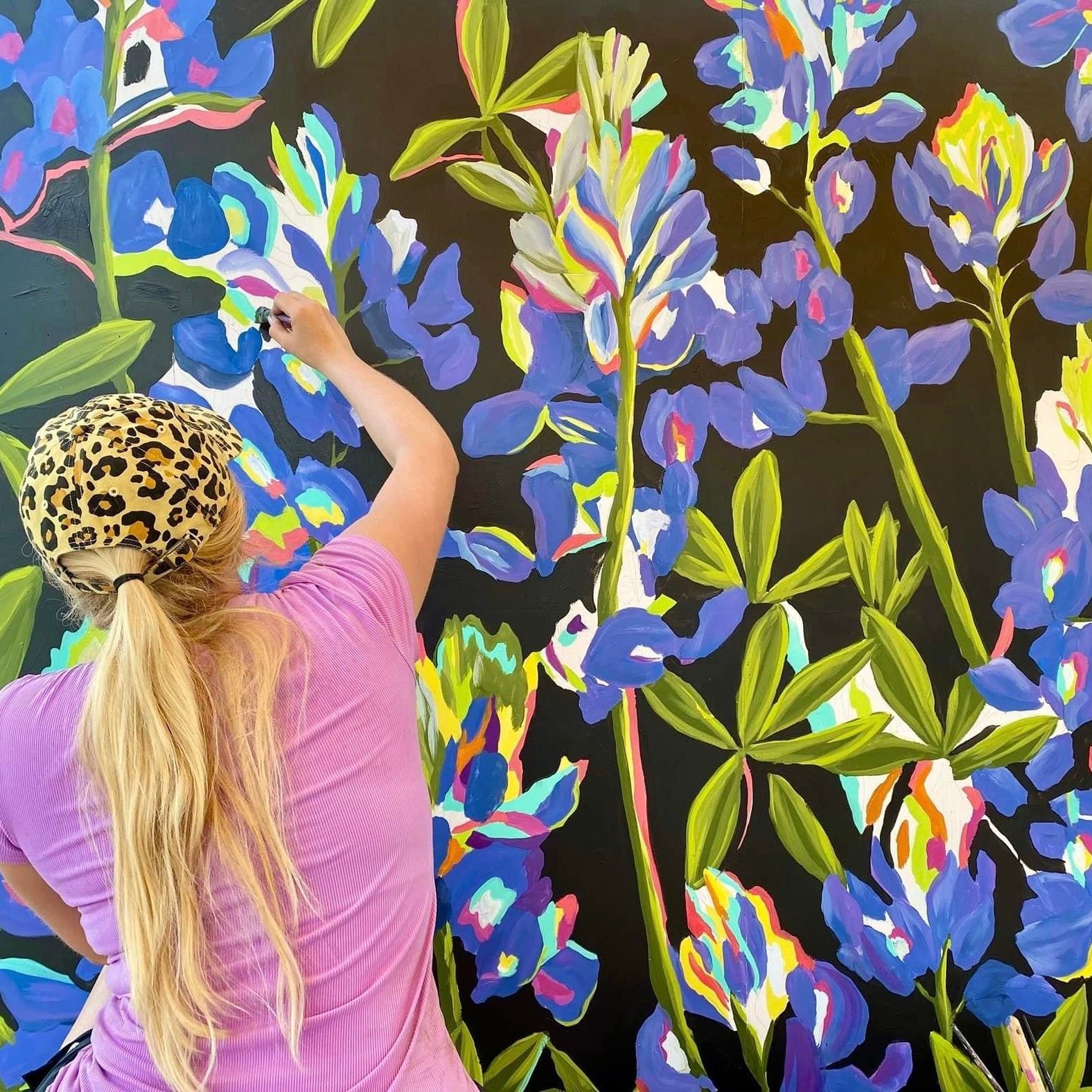Tyler Kay painting Texas bluebonnets for the Bluebonnets Giclée Print collection.