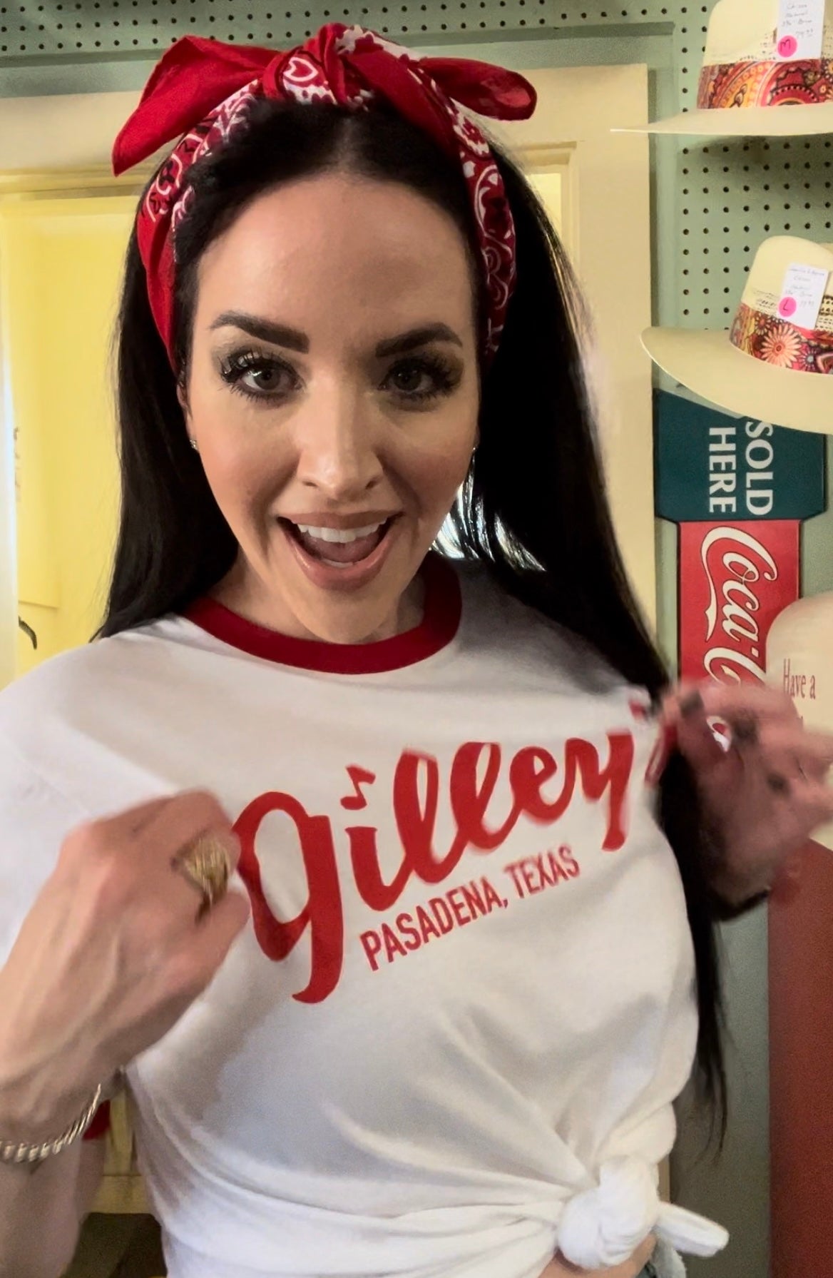 Model wearing the official Gilley's white ringer T-shirt with the classic Pasadena, Texas logo