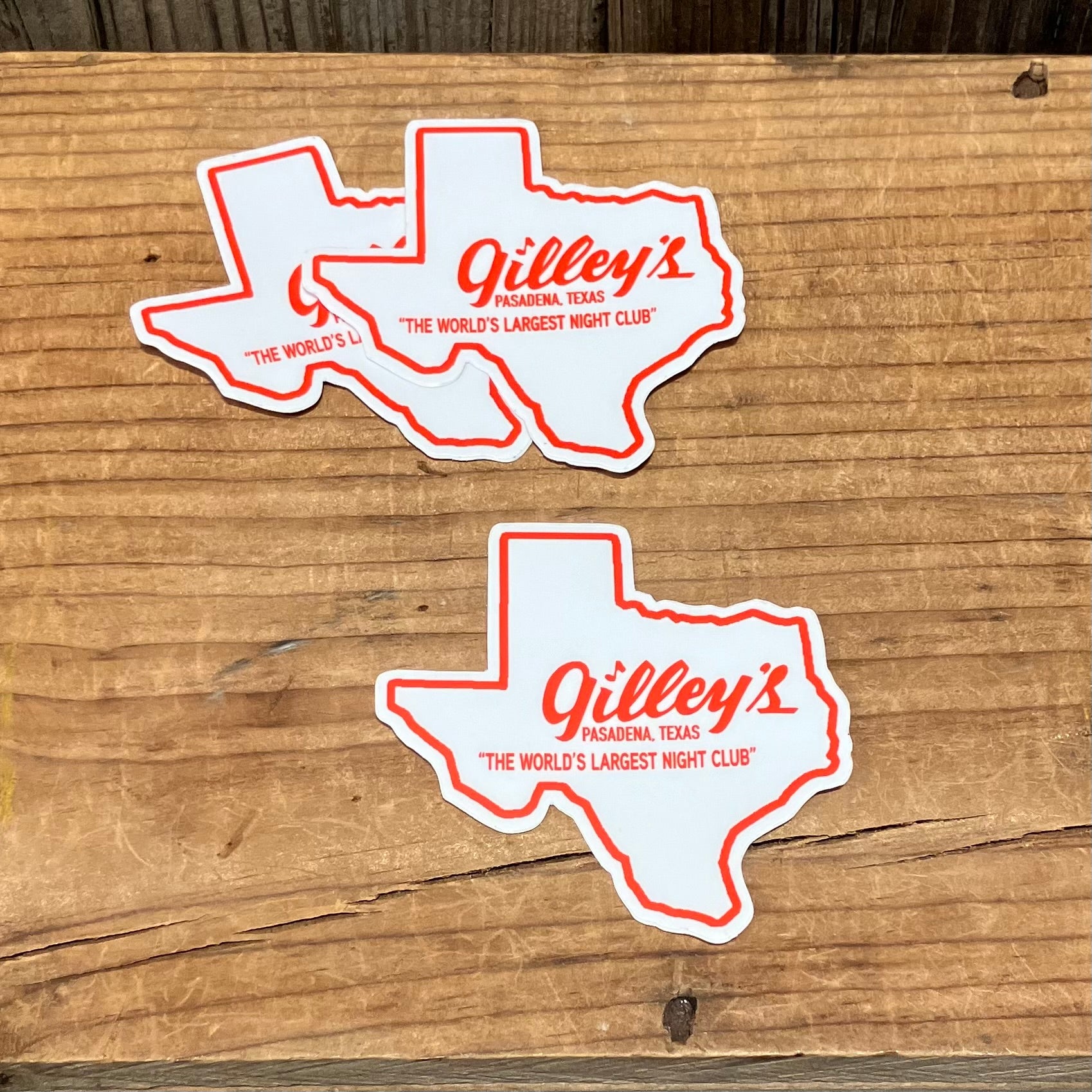 Vintage inspired Texas shaped vinyl sticker in white, outlined in red, with Gilley's Pasadena, TX "The World's Largest Night Club" logo written in red.

size x" x x", vinyl
