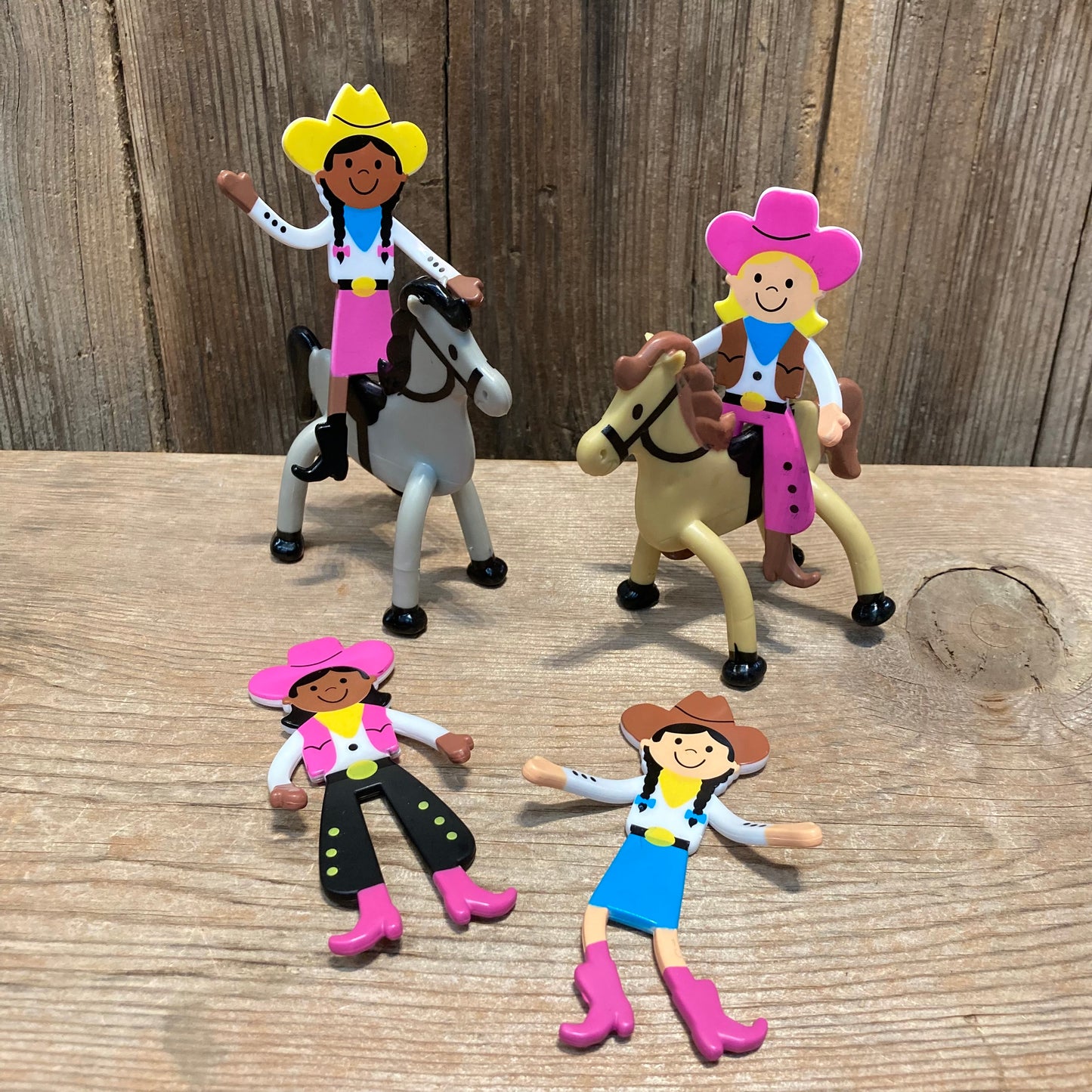 Bendable Horses

Cowboys and cowgirls sold separately.

4" tall, vinyl. Yellow hat , blue bandana, white shirt and pink skirt with dark skin and dark hair cowgirl on a grey horse with black mane. Pink hat, blue bandana, brown vest, white shirt, pink chaps cowgirl on a tan horse with brown mane.  Variations pink hat, yellow bandana, white shirt, pink vest, black chaps, pink boots, dark skin, dark hair cowgirl or brown hat, dark hair, light skin, yellow bandana, white shirt, blue skirt, pink boots