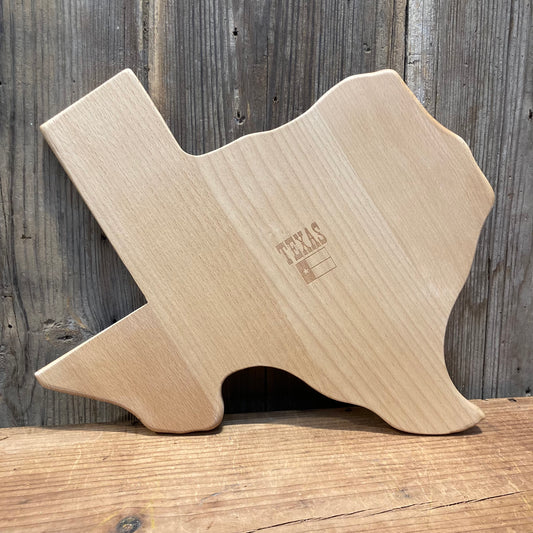 Texas shaped cutting board ready for charcuterie or display.

wood. laser Texas flag design in the middle. approx. 16"x16" boxed.