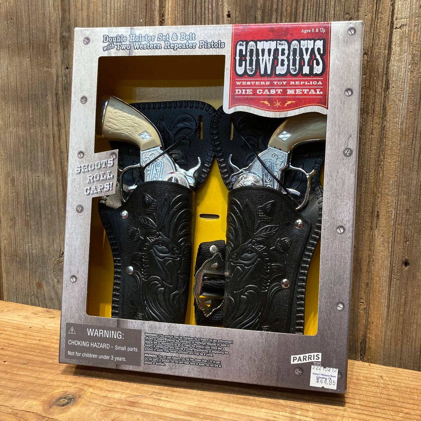 toy cap gun double holster set with two metal pistols and belt