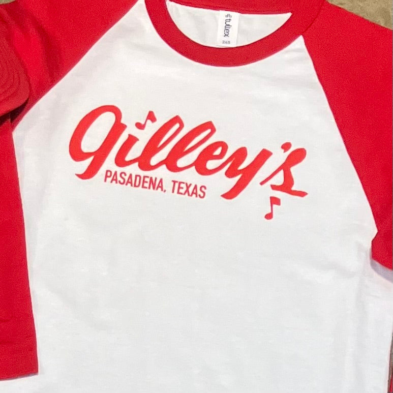 Close-up of the Gilley’s Raglan Shirt in red and white, featuring the iconic Gilley’s Pasadena, Texas logo. A classic and comfortable choice for fans of vintage style.