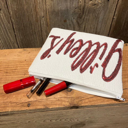 Gilley’s Sequin Makeup Bag with a sparkling red sequin logo, featuring makeup essentials like lipstick and mascara spilling out. Stylish and functional for everyday use.