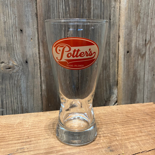 single Potter’s Pilsner pint glass with red logo