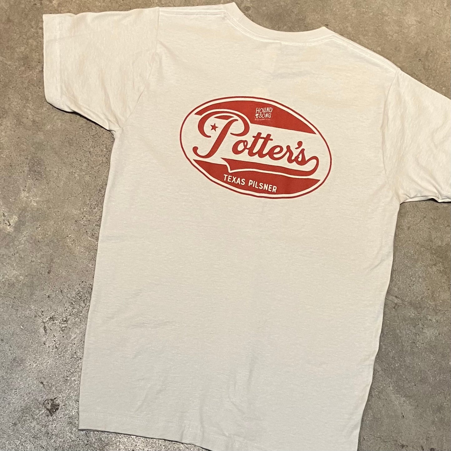 full back view of Potter’s Texas Pilsner shirt with red oval logo