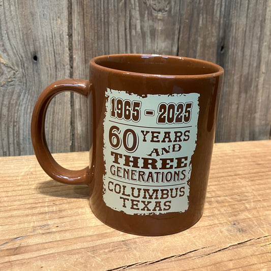 brown ceramic mug with 60 years and three generations design from Potter’s Western Store