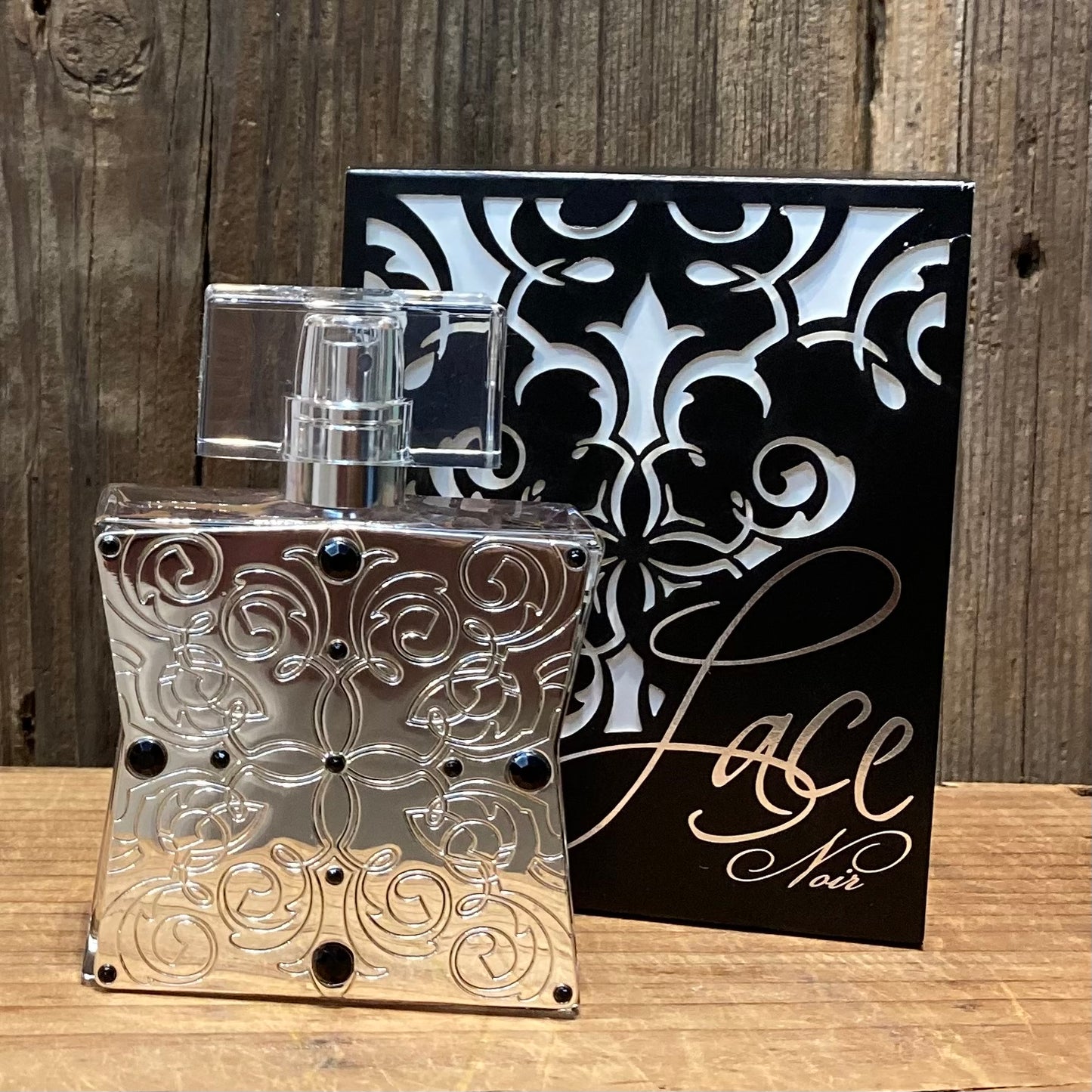  Lace Perfume Collection.

Lace Noir in a black and white embossed box. Bottle is silver with embossed detailing on the front.

Soft and irresistible.

Scent Notes: peach nectar, wild berries, gardenia blossom, caramel toffee.

1.7oz/50ml