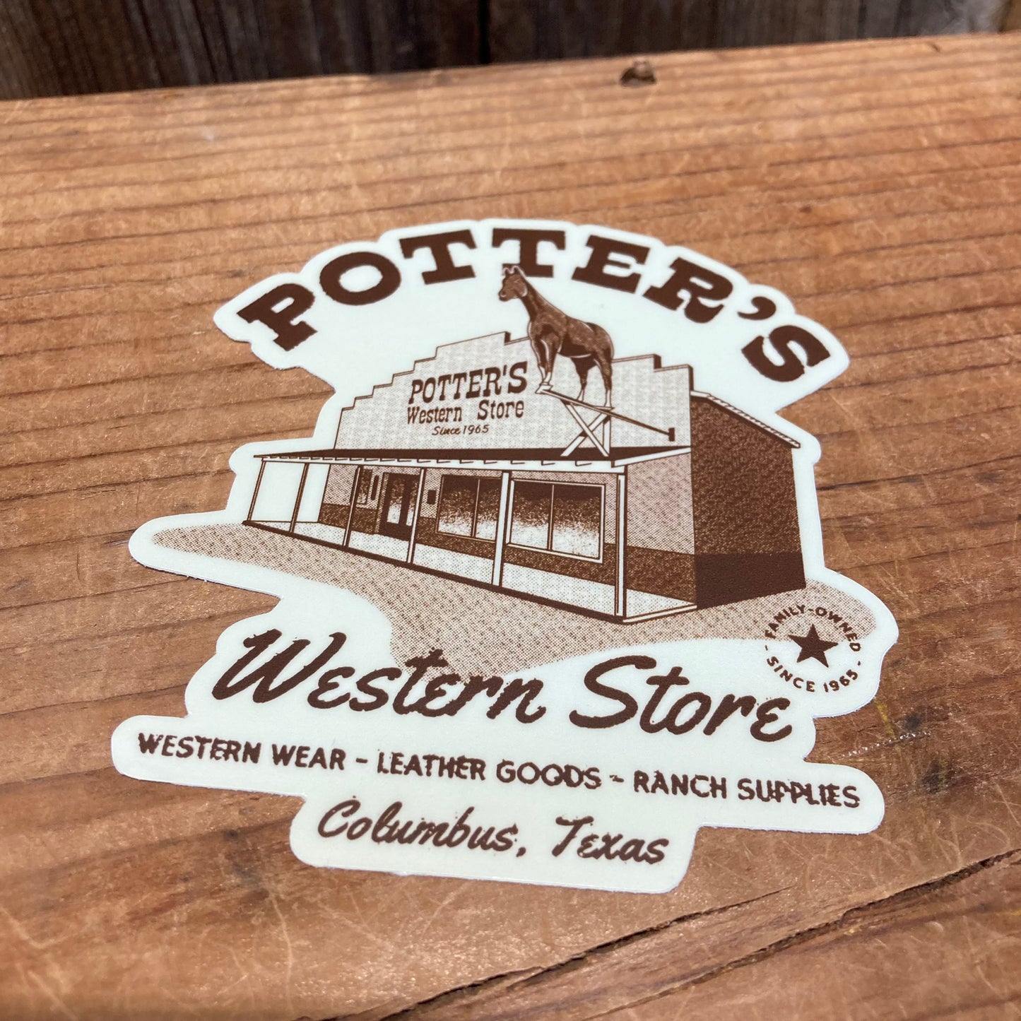 Potter's Stickers
Slap one on your truck, your Jeep, your RV, ...suitcase, laptop.

NEW die cut sticker featuring the Store and iconic horse. White background with store front and writing in brown. Potter's Western Store Western wear-leather goods-ranch supplies Columbus, TX. Family owned and operated since 1965

Vinyl. Aprox. 3.5" x 4"