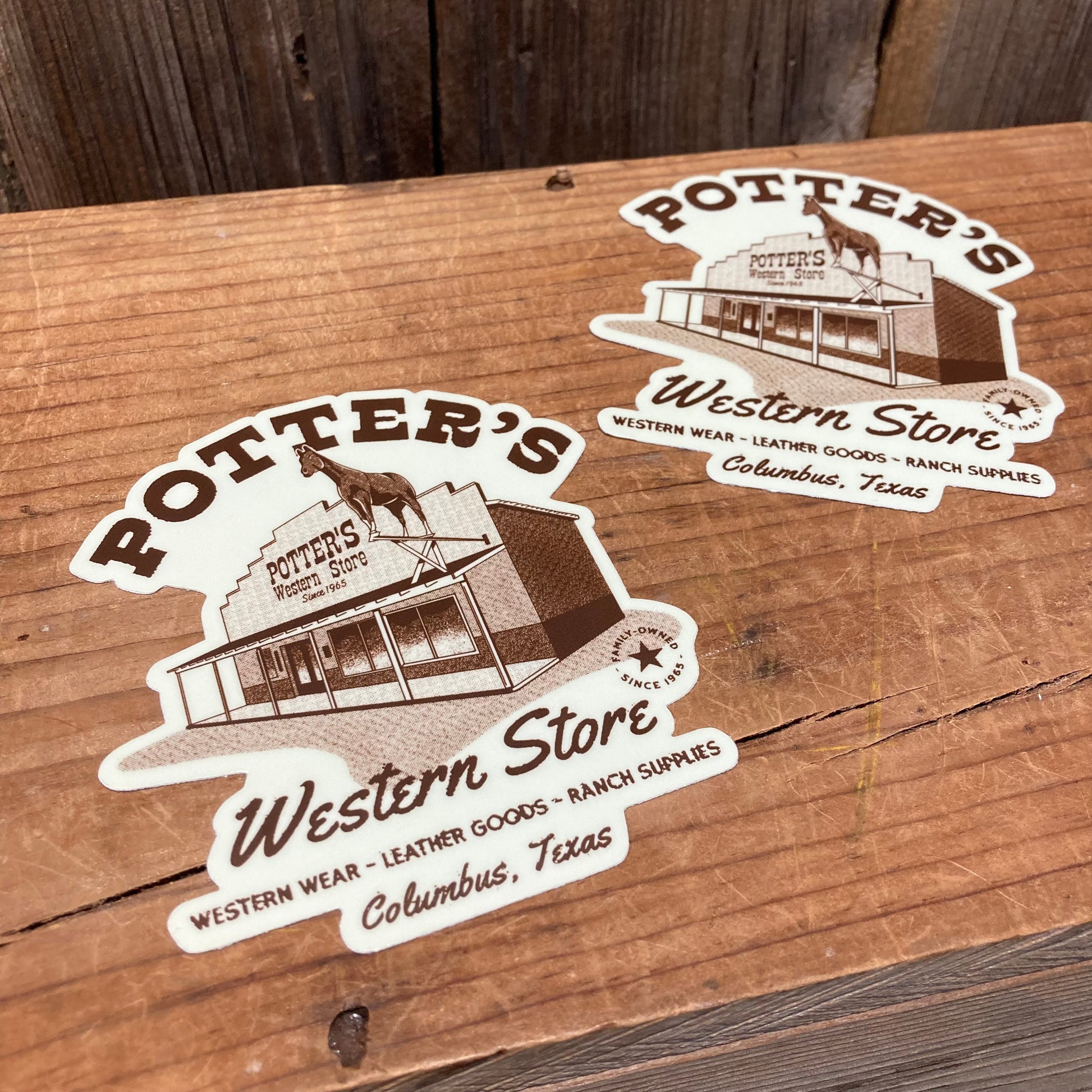 Potter's Stickers
Slap one on your truck, your Jeep, your RV, ...suitcase, laptop.

NEW die cut sticker featuring the Store and iconic horse. White background with store front and writing in brown. Potter's Western Store Western wear-leather goods-ranch supplies Columbus, TX. Family owned and operated since 1965

Vinyl. Aprox. 3.5" x 4"