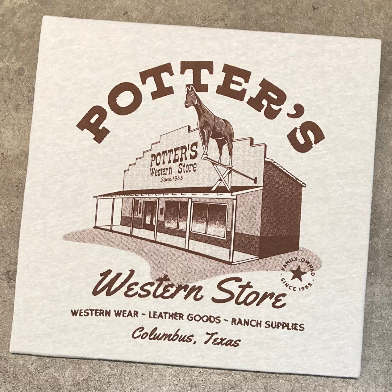 Close-up of the Potter's Western Store Classic T-shirt graphic featuring the original storefront.